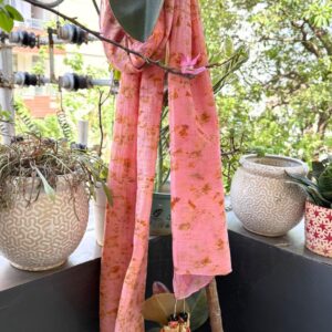 Shakuntala scarf in baby pink sappanwood dye with marigold bundle dye on mul cotton, finished with orange Shakuntala doll tassels - SewMuchBetter