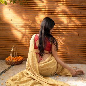 Habutai silk saree in warm yellow marigold dye with temple marigold bundle dye impressions and handcrafted doll tassels - SewMuchBetter